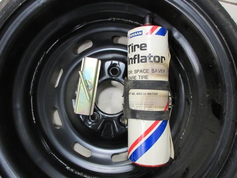 84-89 Nissan 300ZX UNUSED spare tire w/inflator and tie Down | eBay