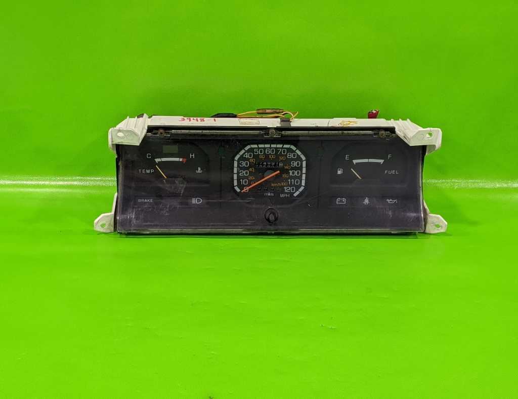 85 86 MIGHTY MAX PICKUP D50 SPEEDOMETER CLUSTER 174K MILES OEM